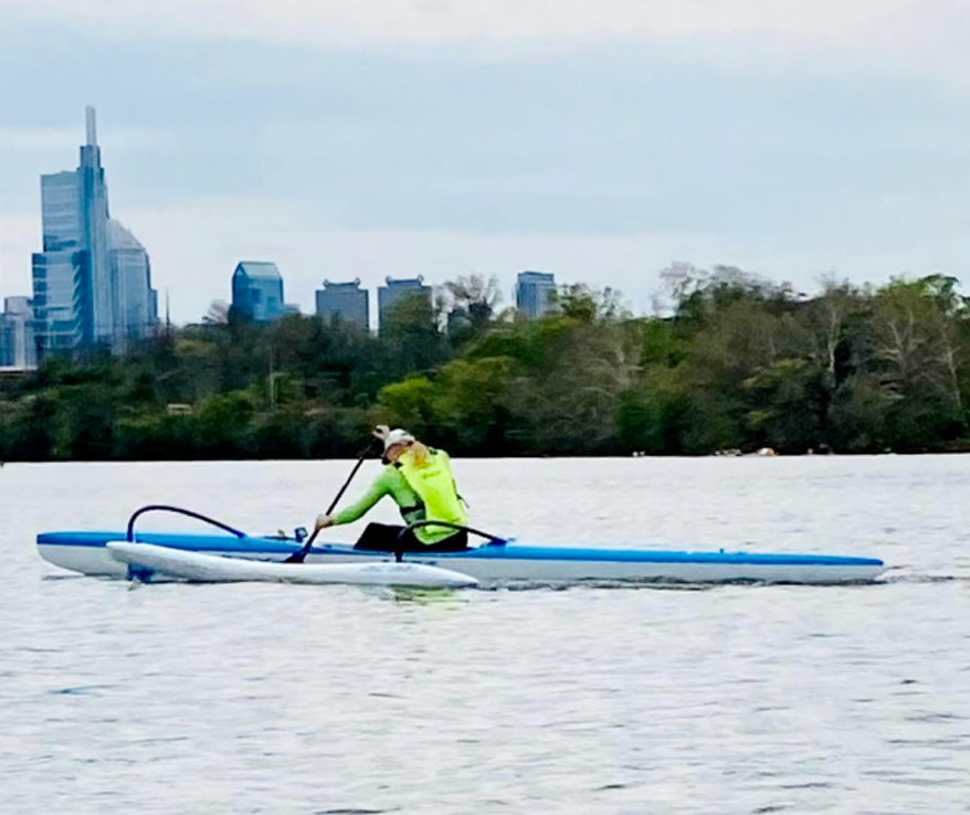 Photo of a person paddling a canoe